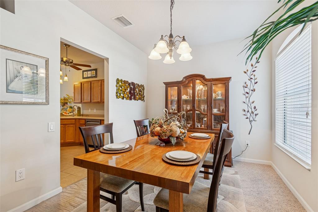 894 Lantern Way Clearwater, FL 33765 - Photo 27 of 75 a view of a dining room with furniture window and wooden floor