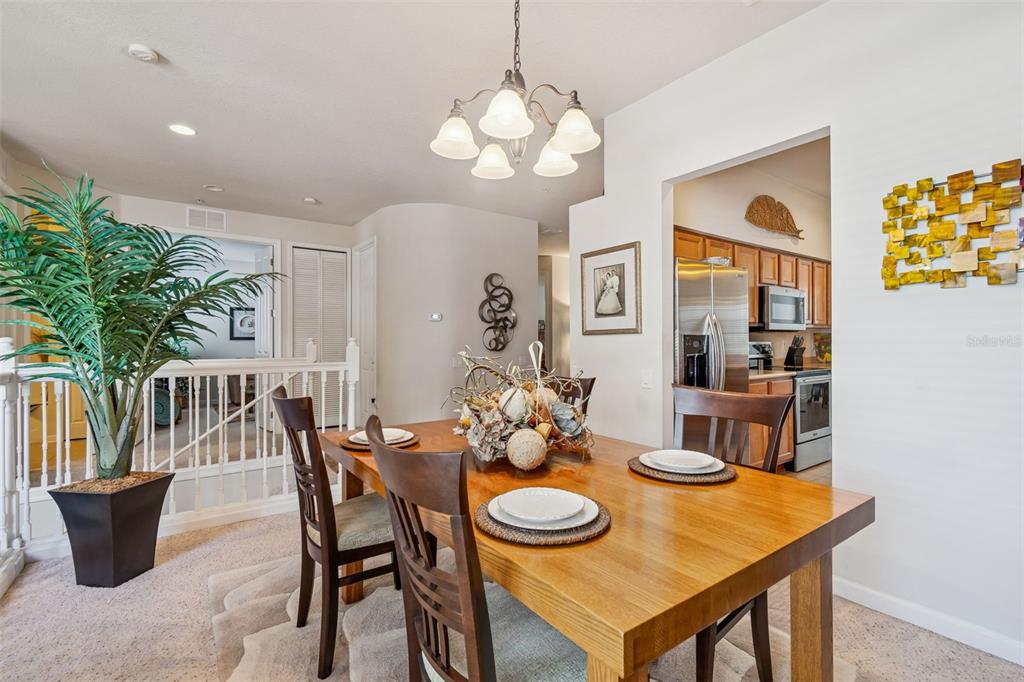 894 Lantern Way Clearwater, FL 33765 - Photo 28 of 75 a view of a dining room with furniture and chandelier