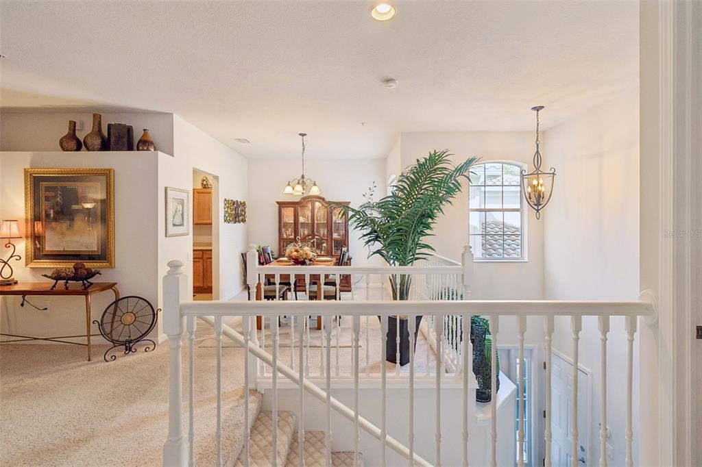 894 Lantern Way Clearwater, FL 33765 - Photo 40 of 75 a view of a balcony with chairs and iron gate