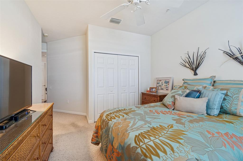 894 Lantern Way Clearwater, FL 33765 - Photo 43 of 75 a bedroom with bed and flat screen tv