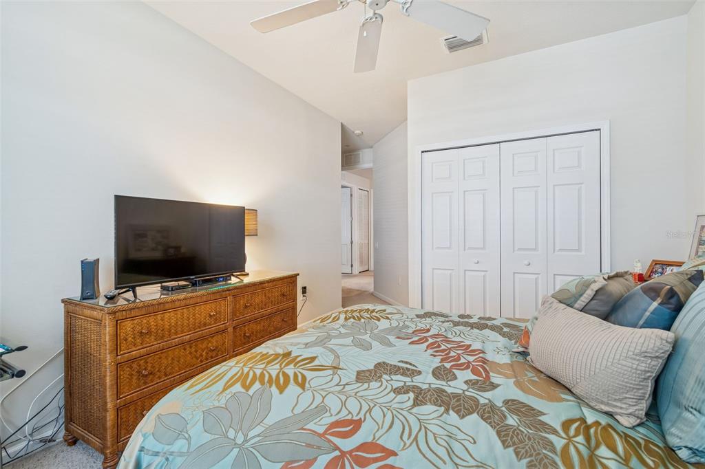 894 Lantern Way Clearwater, FL 33765 - Photo 44 of 75 a bedroom with a bed and a flat screen tv