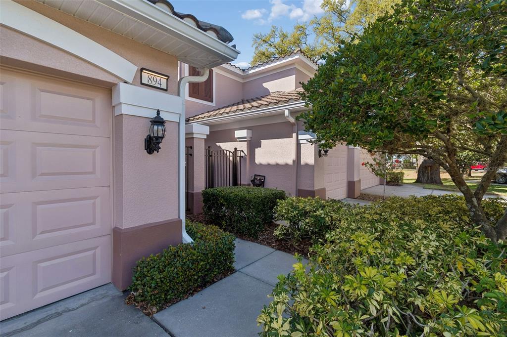 894 Lantern Way Clearwater, FL 33765 - Photo 5 of 75 a front view of a house with a yard