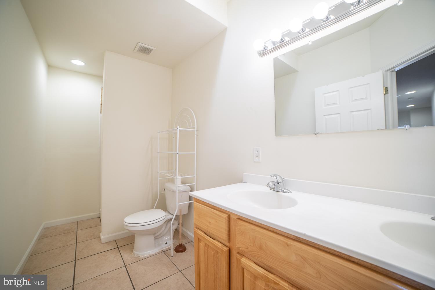 1838 North 16th Street, Unit 2 Philadelphia, PA 19121 - Photo 4 of 17 a bathroom with a sink a toilet and shower