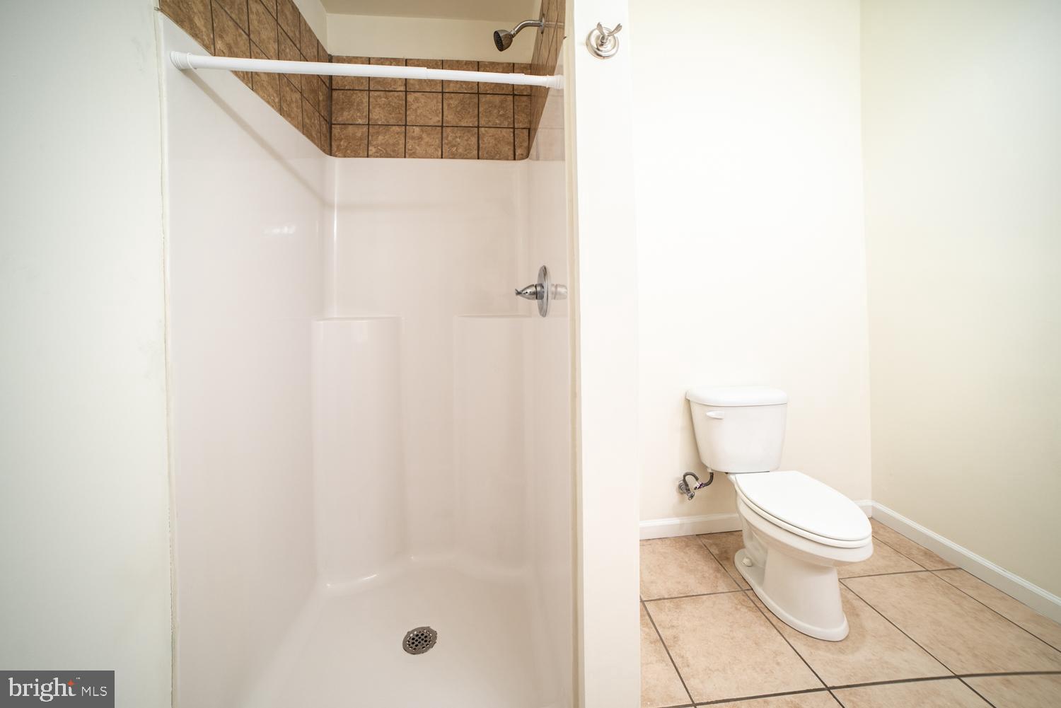 1838 North 16th Street, Unit 2 Philadelphia, PA 19121 - Photo 6 of 17 a white toilet sitting next to a shower