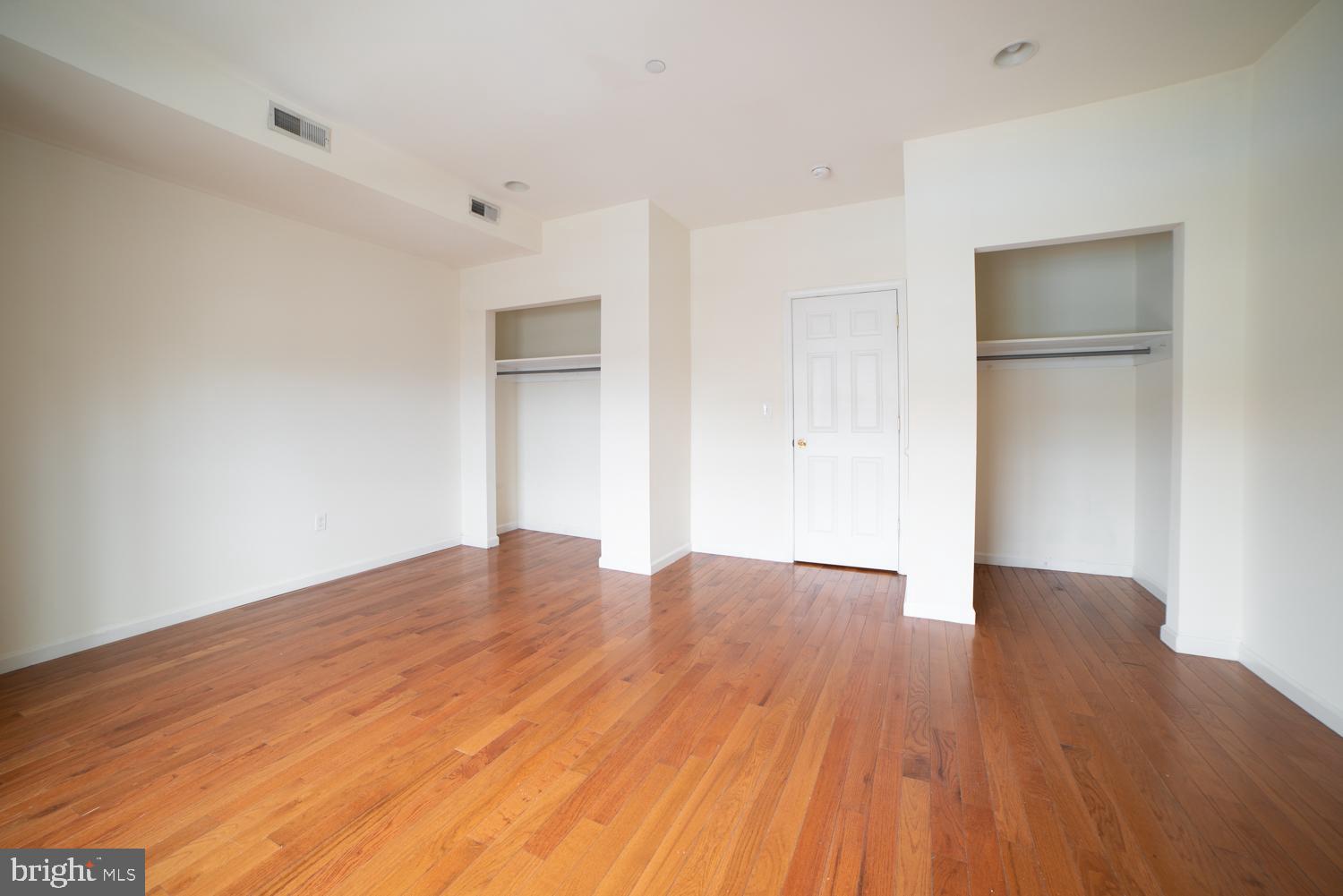 1838 North 16th Street, Unit 2 Philadelphia, PA 19121 - Photo 8 of 17 a view of empty room with wooden floor and entryway