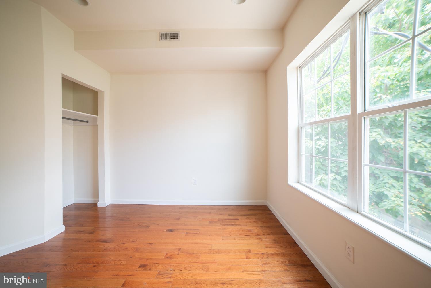 1838 North 16th Street, Unit 2 Philadelphia, PA 19121 - Photo 10 of 17 a view of empty room with wooden floor and fan