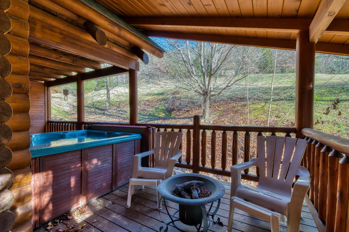 3124 Smoky Ridge Way Sevierville, TN 37862 - Photo 12 of 14 a view of deck with furniture and a backyard