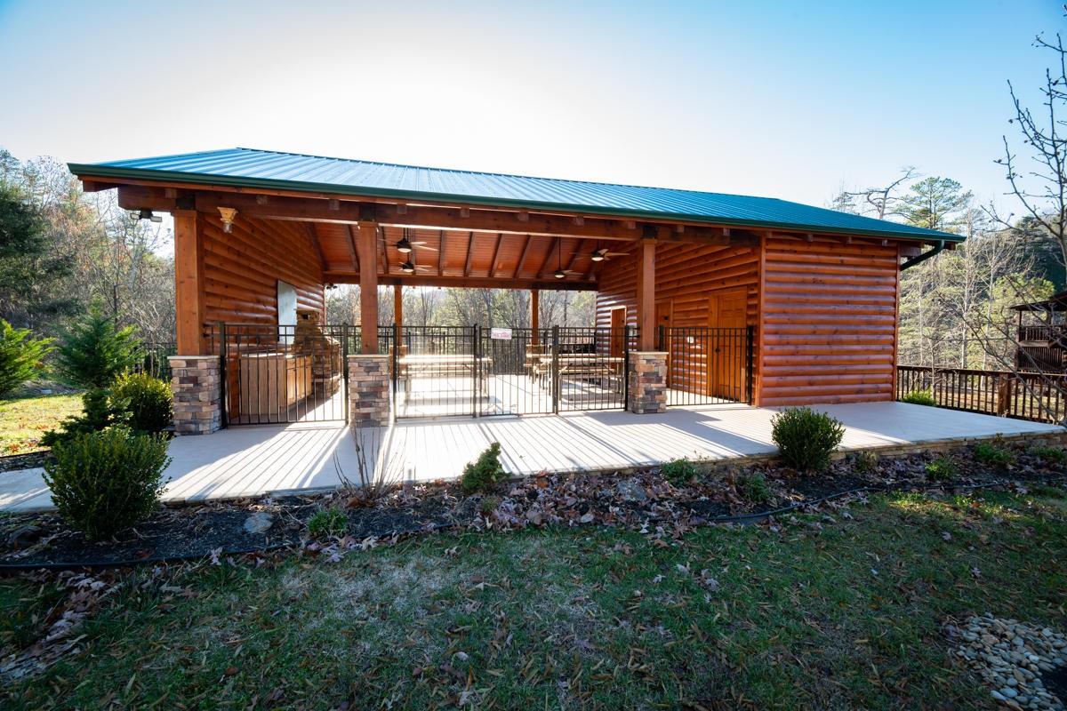 3124 Smoky Ridge Way Sevierville, TN 37862 - Photo 13 of 14 a backyard of a house with yard and outdoor seating