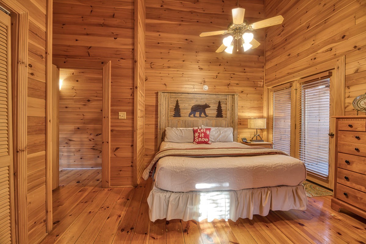 3124 Smoky Ridge Way Sevierville, TN 37862 - Photo 6 of 14 a room with a bed and a chandelier