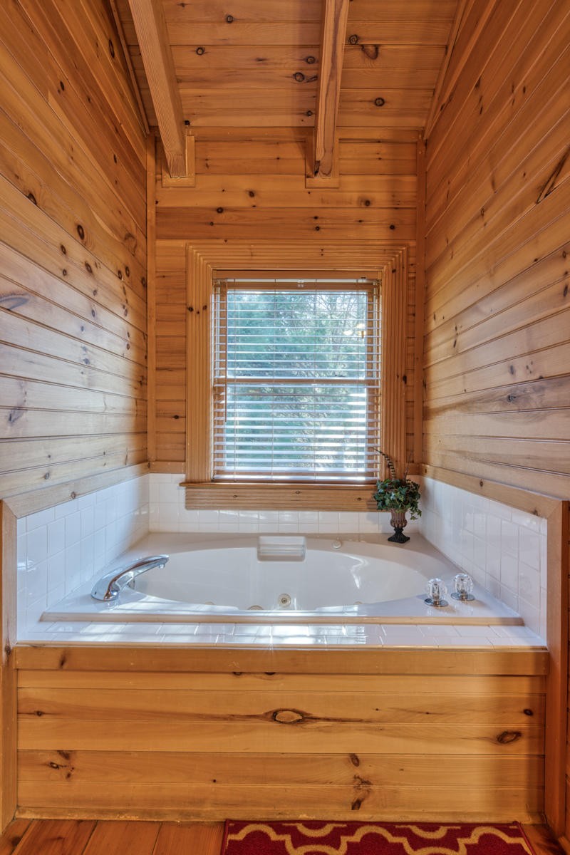 3124 Smoky Ridge Way Sevierville, TN 37862 - Photo 8 of 14 a view of bathroom with bathtub and window