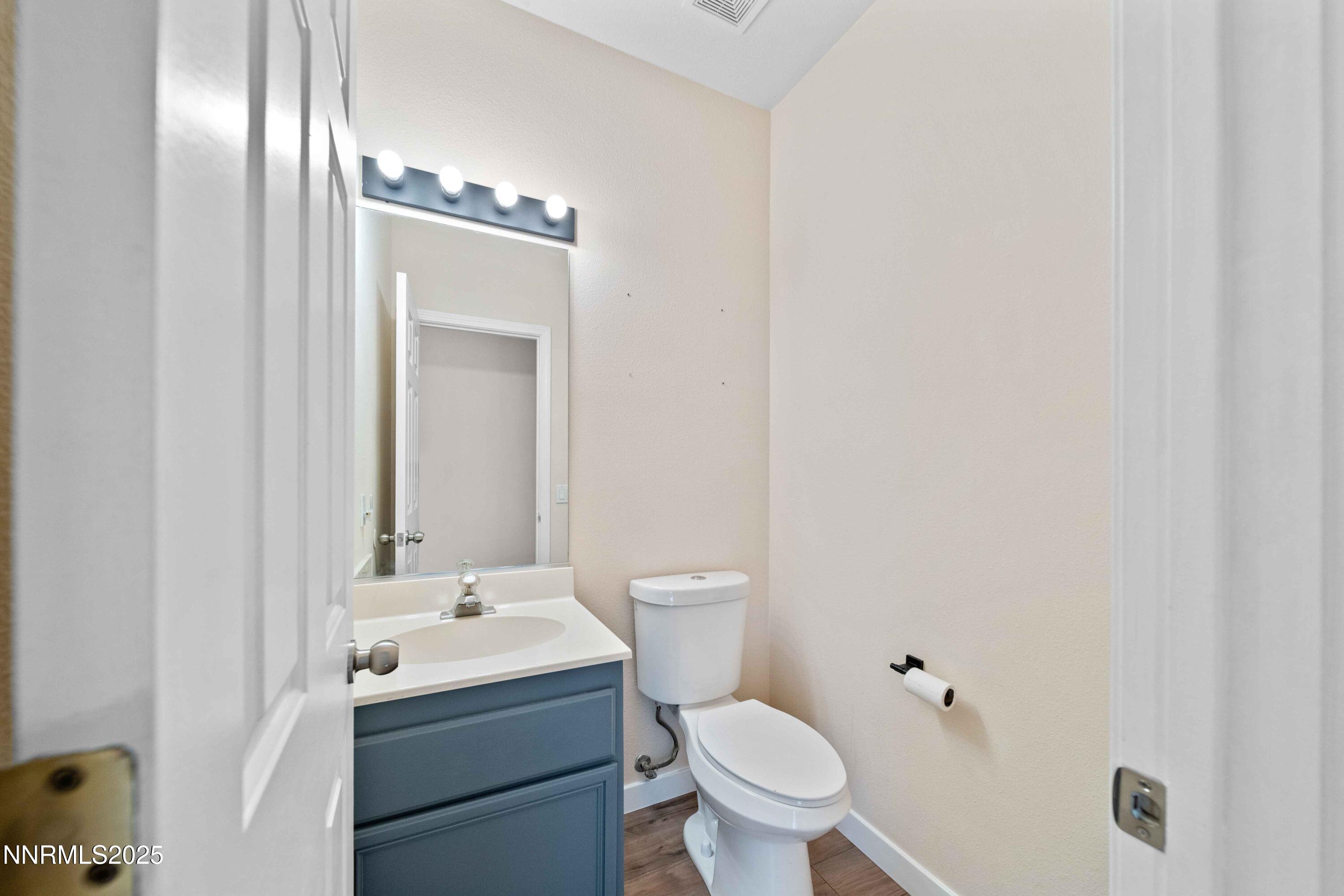 5420 Brittania Drive Reno, NV 89523 - Photo 8 of 25 a bathroom with a sink and mirror with toilet