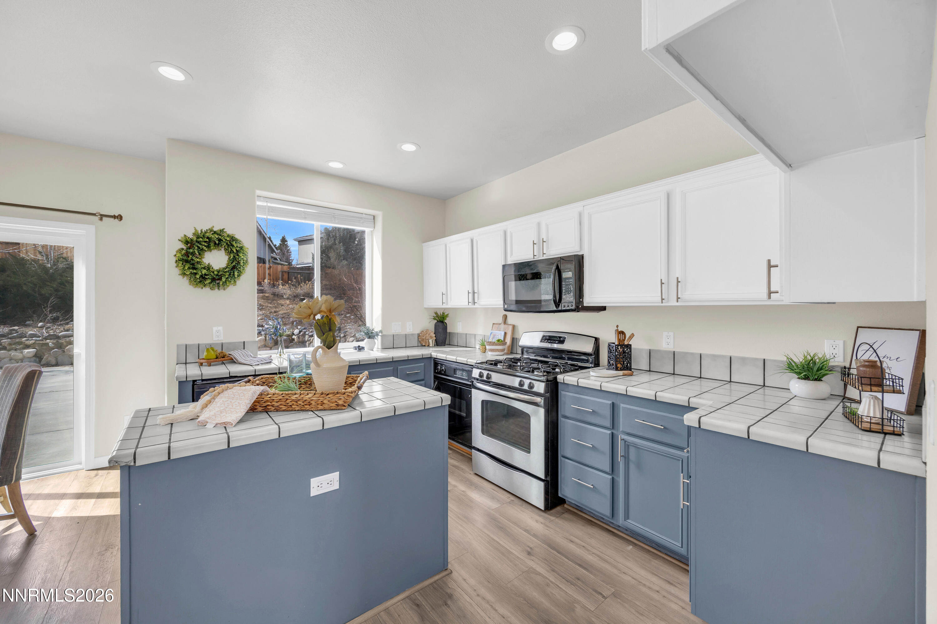 5420 Brittania Drive Reno, NV 89523 - Photo 9 of 25 a kitchen with stainless steel appliances granite countertop a sink a stove top oven a counter space and cabinets