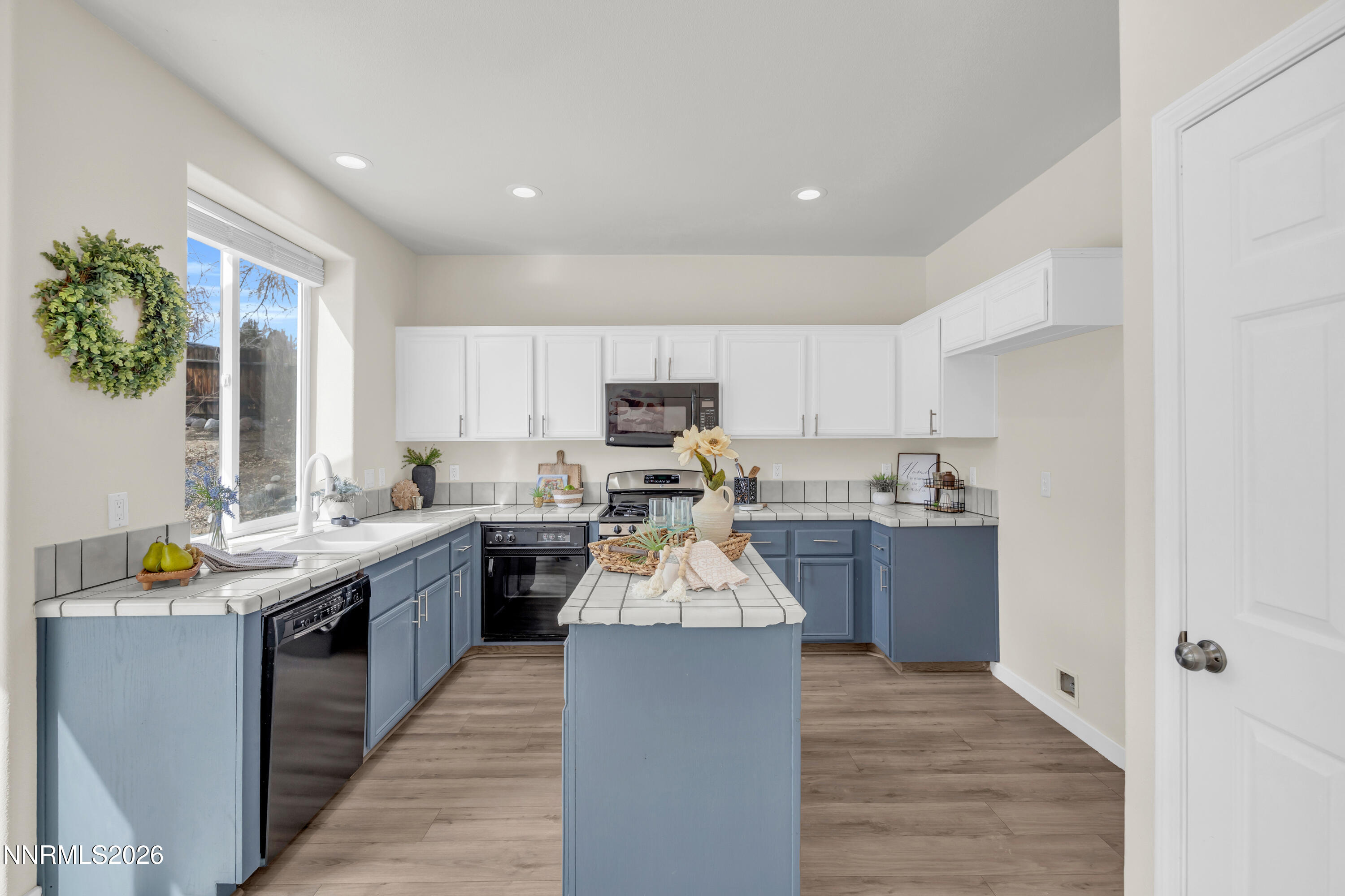 5420 Brittania Drive Reno, NV 89523 - Photo 10 of 25 a kitchen with stainless steel appliances granite countertop sink stove top oven and cabinets