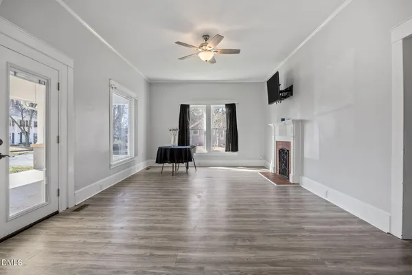 a view of a livingroom with furniture and a window