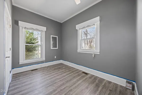 a view of a livingroom with a ceiling fan and window