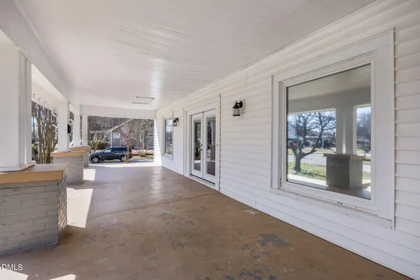 a view of a living room and a balcony