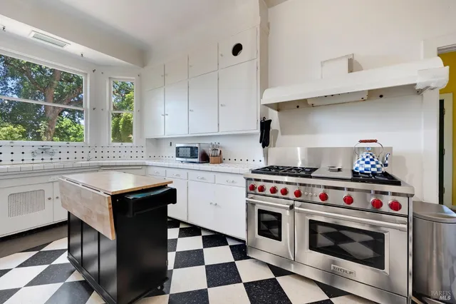 a bedroom with a bed and a desk