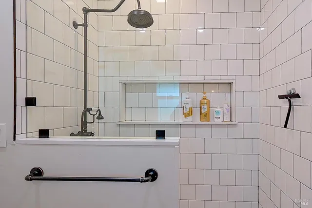 a kitchen that has a lot of cabinets in it and wooden floor