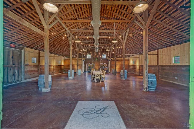 a view of a room with furniture and windows