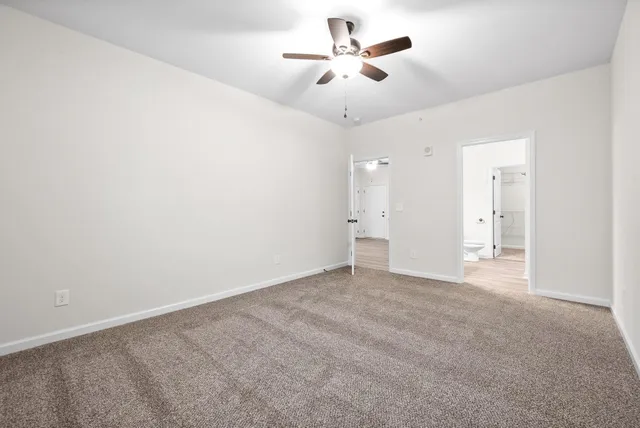 a bathroom with a sink toilet and a mirror