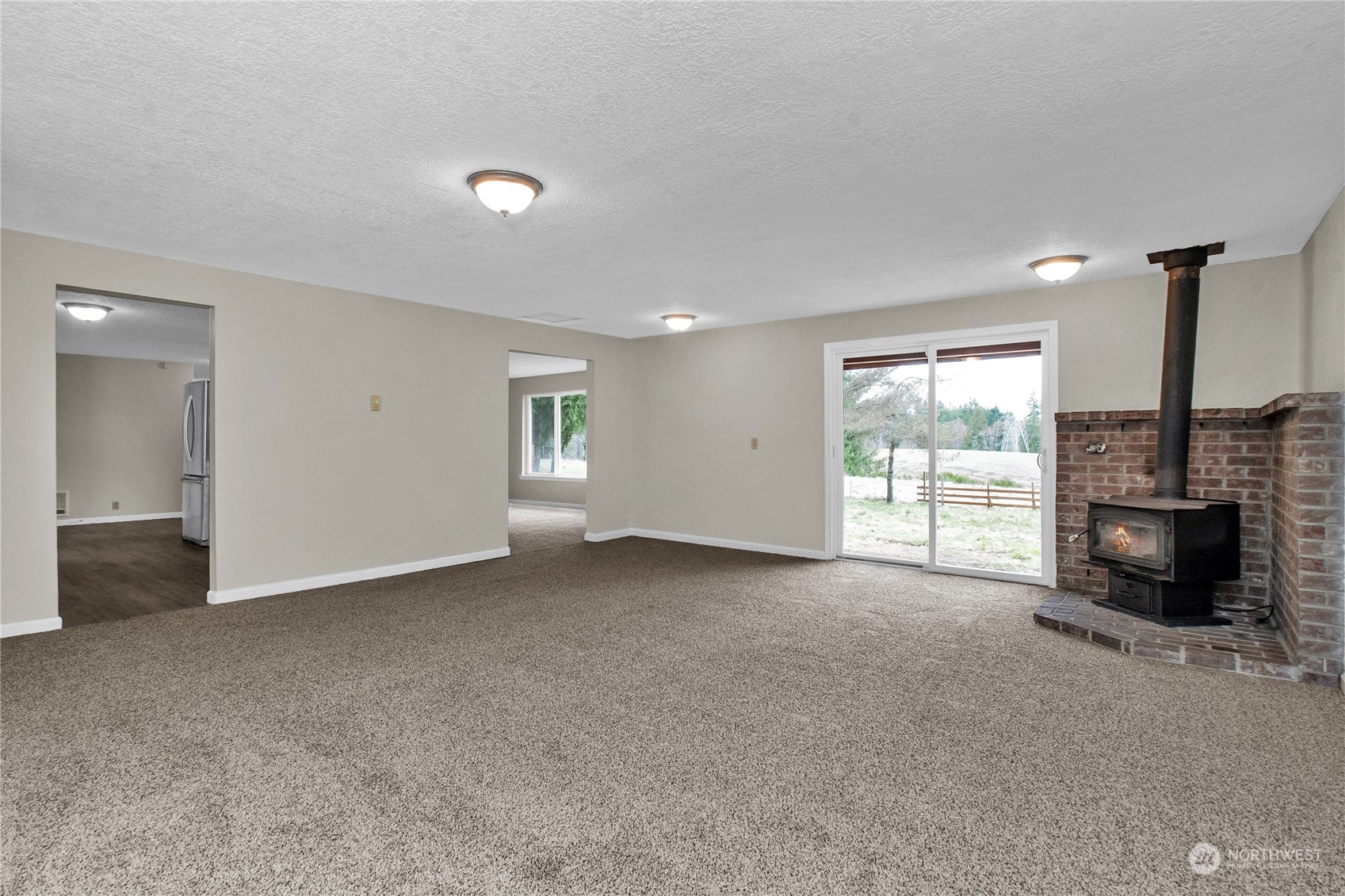 151 Ramsey Road Chehalis, WA 98532 - Photo 12 of 25 a view of an empty room with a fireplace and a window