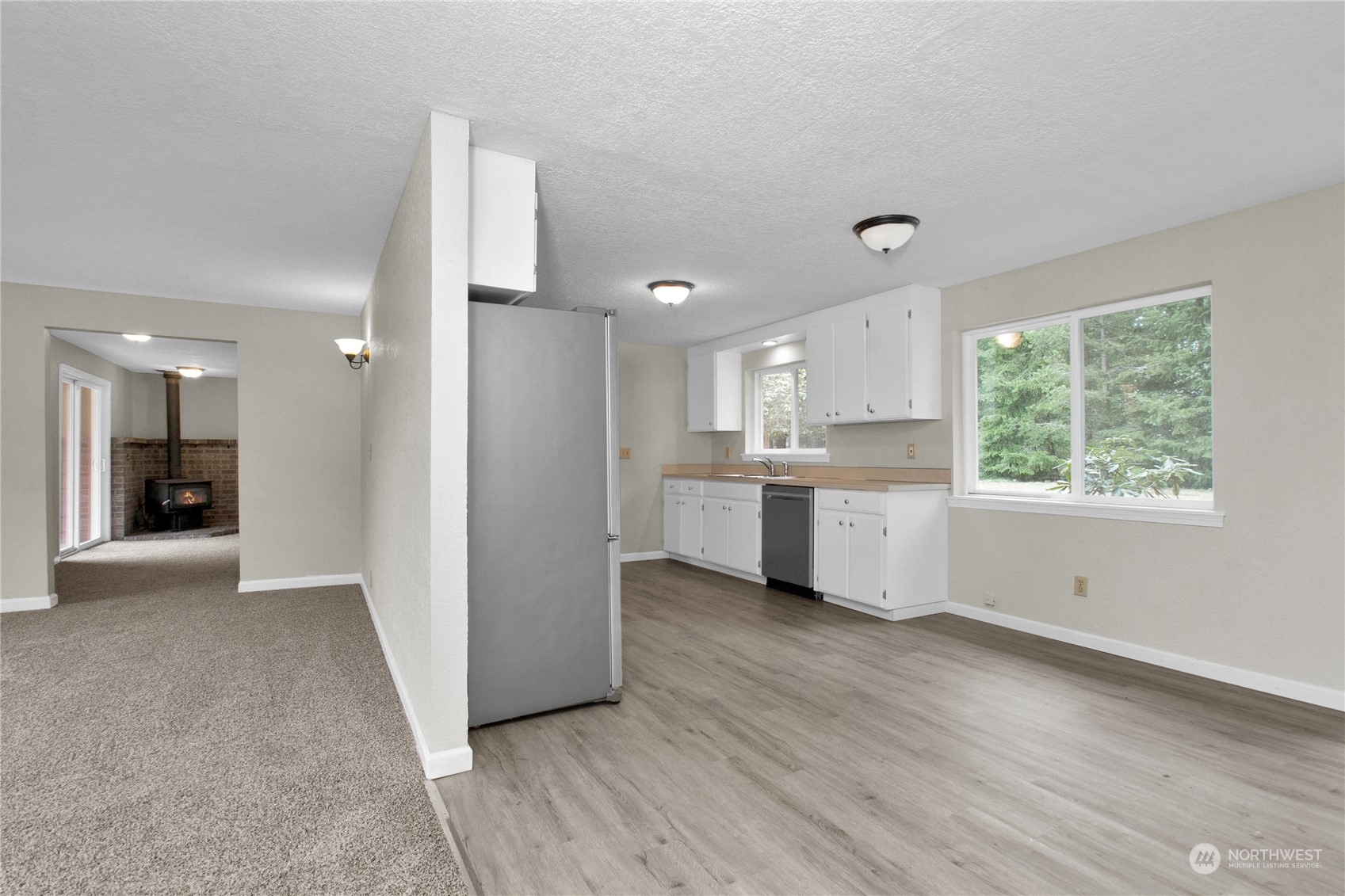 151 Ramsey Road Chehalis, WA 98532 - Photo 7 of 25 a view of a kitchen with wooden floor and a sink