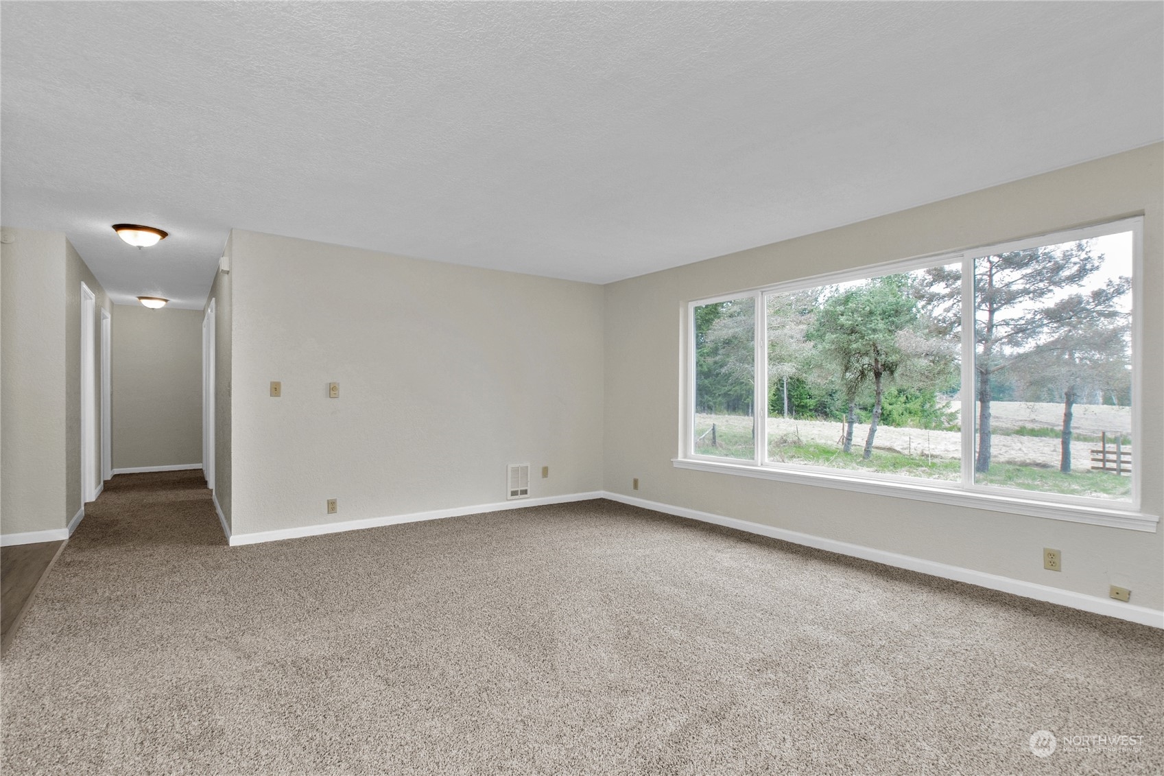 151 Ramsey Road Chehalis, WA 98532 - Photo 8 of 25 a view of an empty room with a window