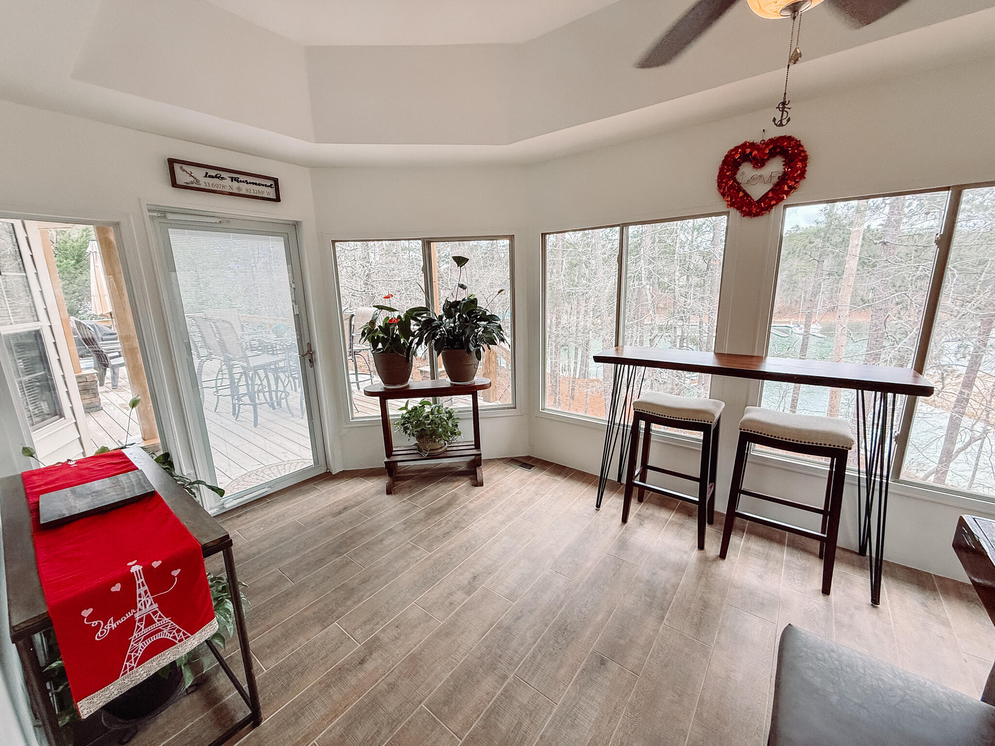 307 Superior Cove McCormick, SC 29835 - Photo 16 of 46 Sunroom with exit to deck and view of lake