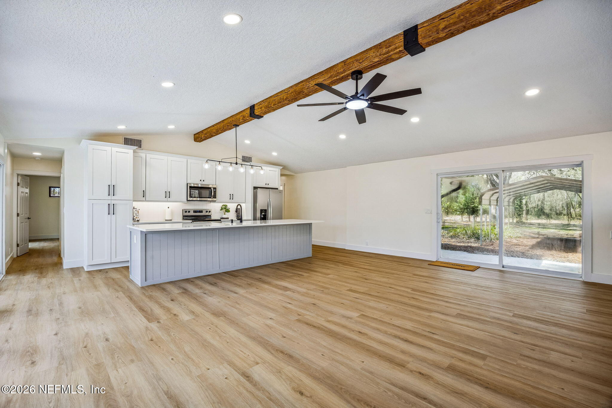 16684 Oak Hill Road Hilliard, FL 32046 - Photo 11 of 33 a view of kitchen with cabinets and wooden floor