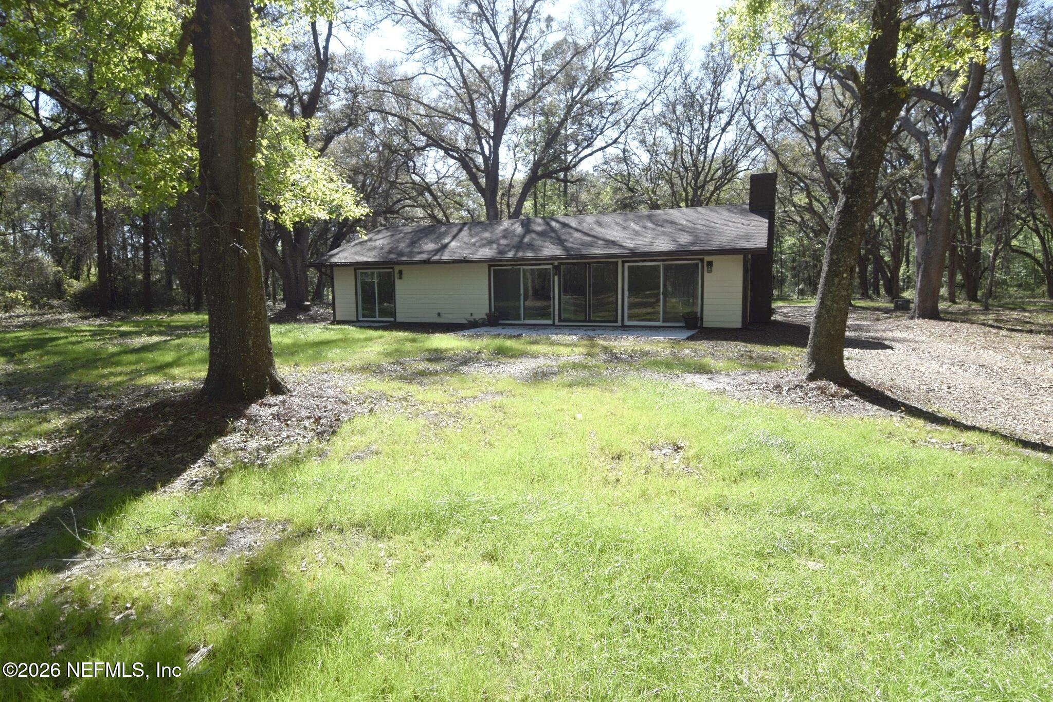 16684 Oak Hill Road Hilliard, FL 32046 - Photo 2 of 33 a view of a house with a yard