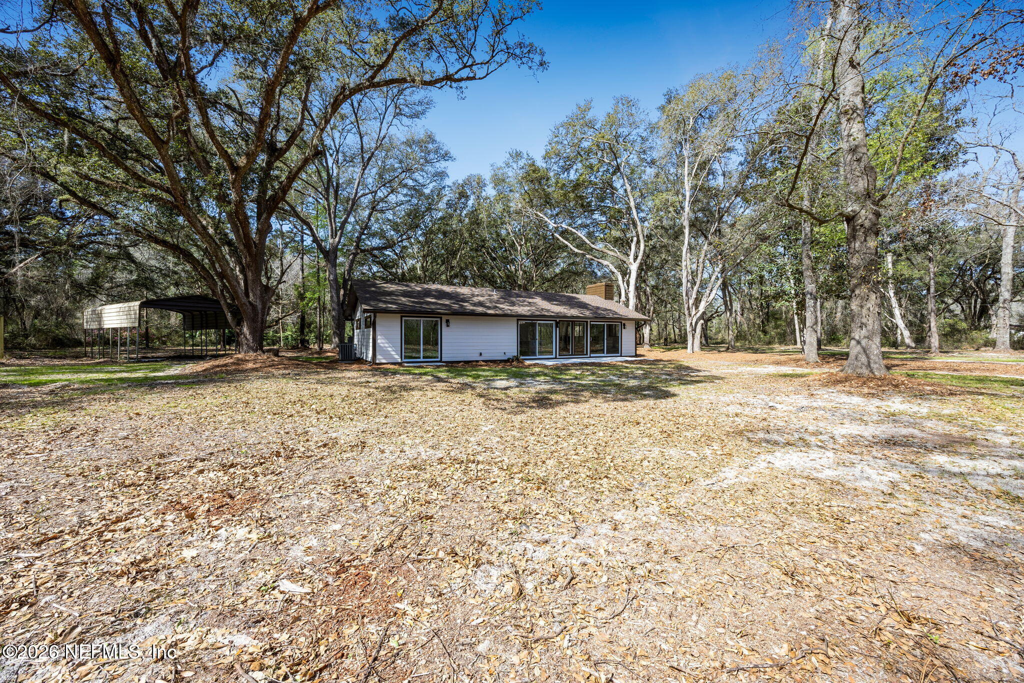16684 Oak Hill Road Hilliard, FL 32046 - Photo 24 of 33 a front view of a house with a yard