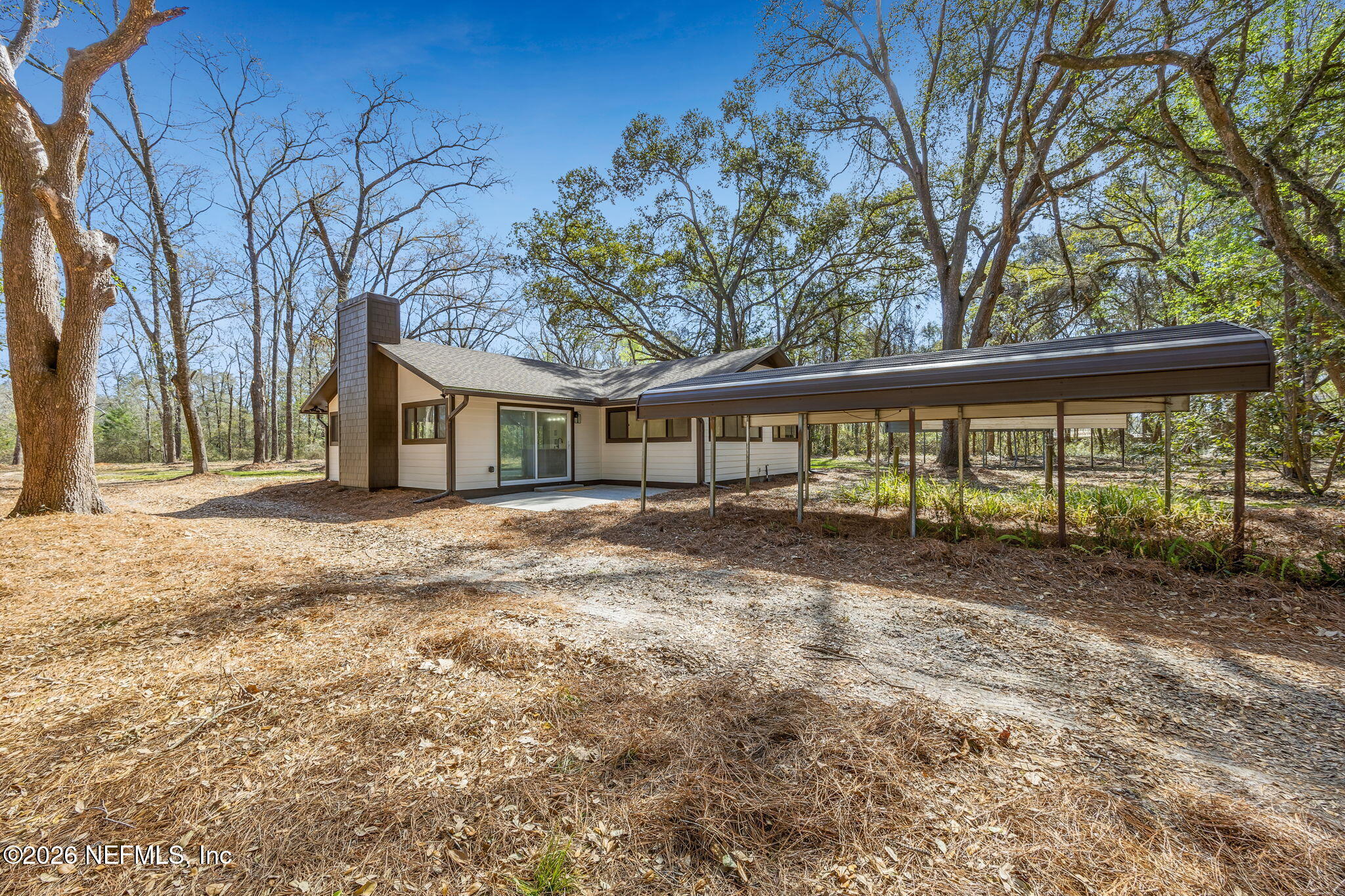 16684 Oak Hill Road Hilliard, FL 32046 - Photo 26 of 33 a view of a house with a yard