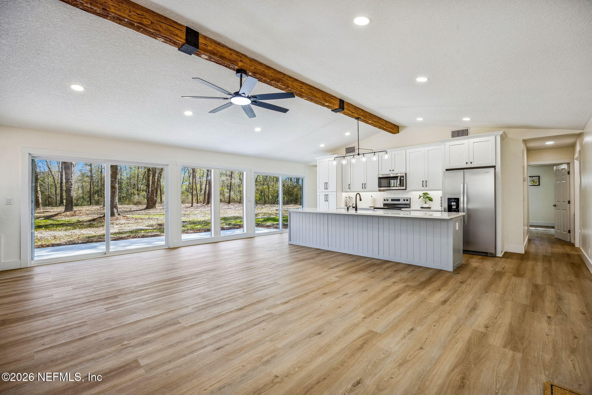 16684 Oak Hill Road Hilliard, FL 32046 - Photo 4 of 33 a view of kitchen with wooden floor and electronic appliances