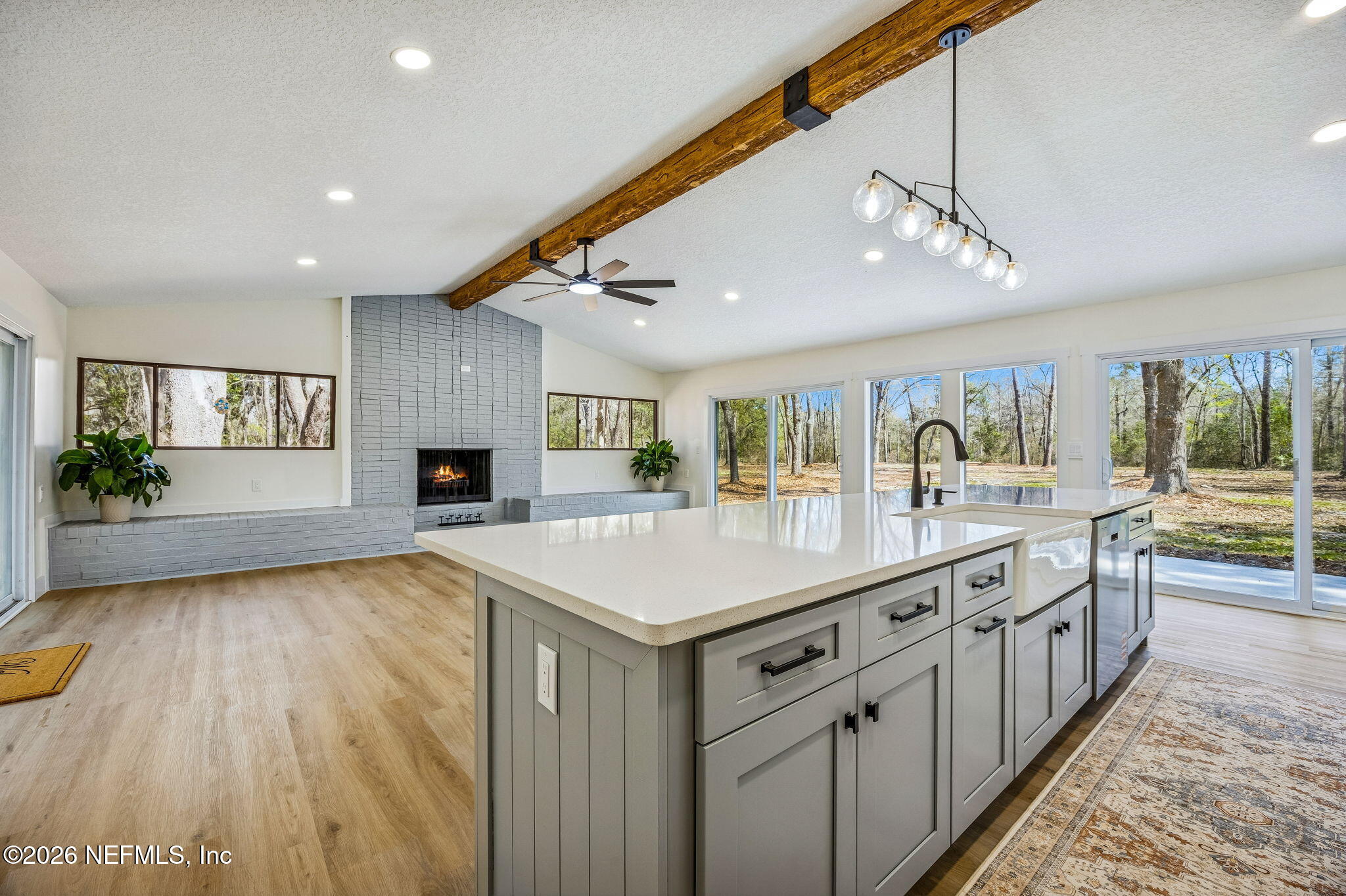 16684 Oak Hill Road Hilliard, FL 32046 - Photo 6 of 33 a large kitchen with kitchen island a large island in it