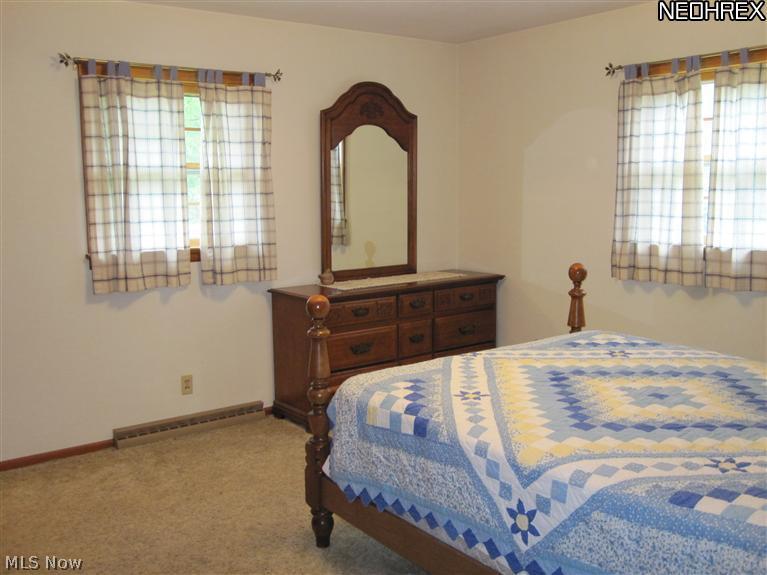 15499 Diagonal Road Lagrange, OH 44050 - Photo 11 of 22 Master Bedroom with Carpet Over Hardwood Floors Offers Master Bath and Nice-Size Walk-In Closet.