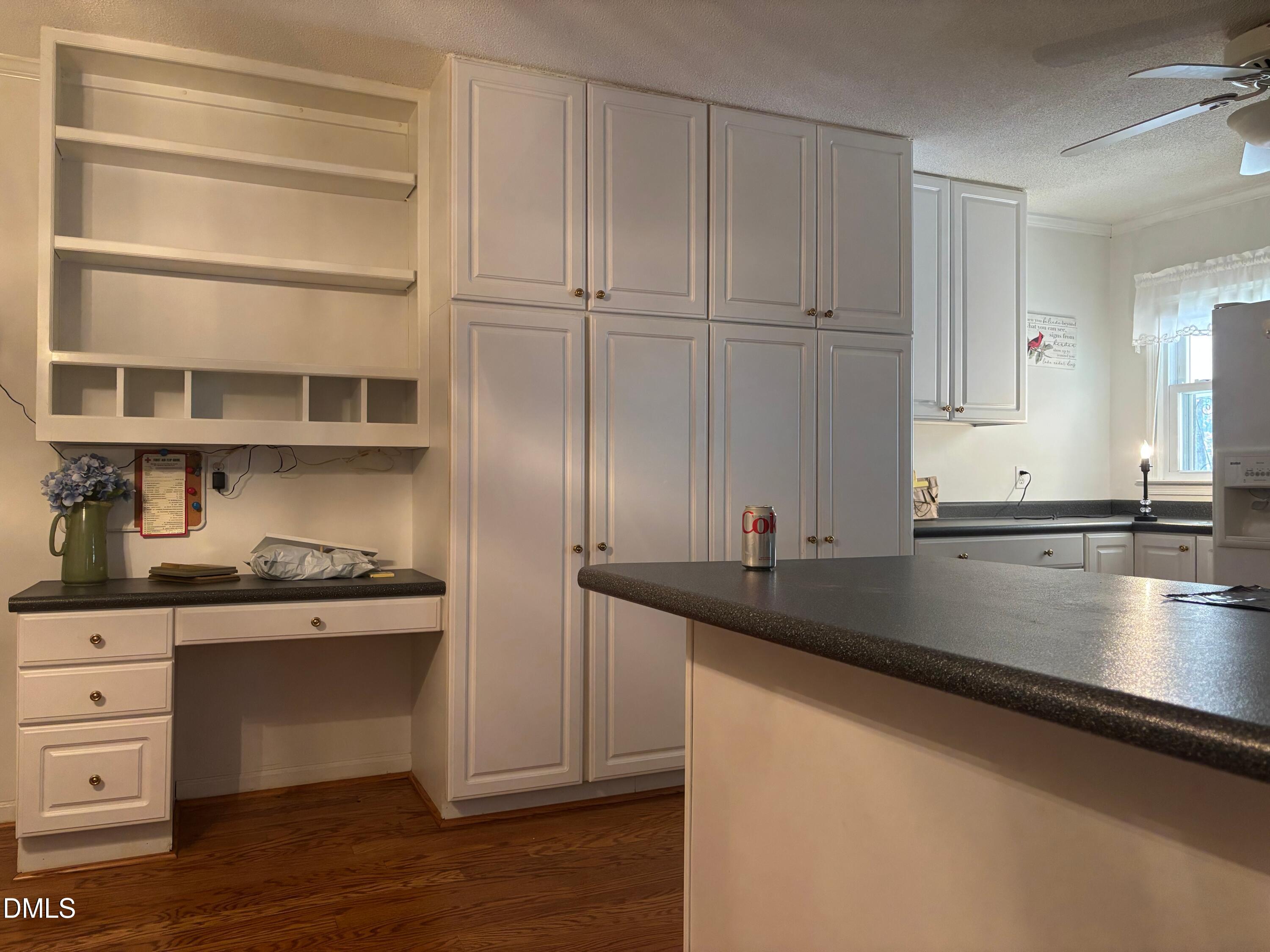 133 Sam Horton Road Louisburg, NC 27549 - Photo 12 of 15 a kitchen with granite countertop a sink and cabinets