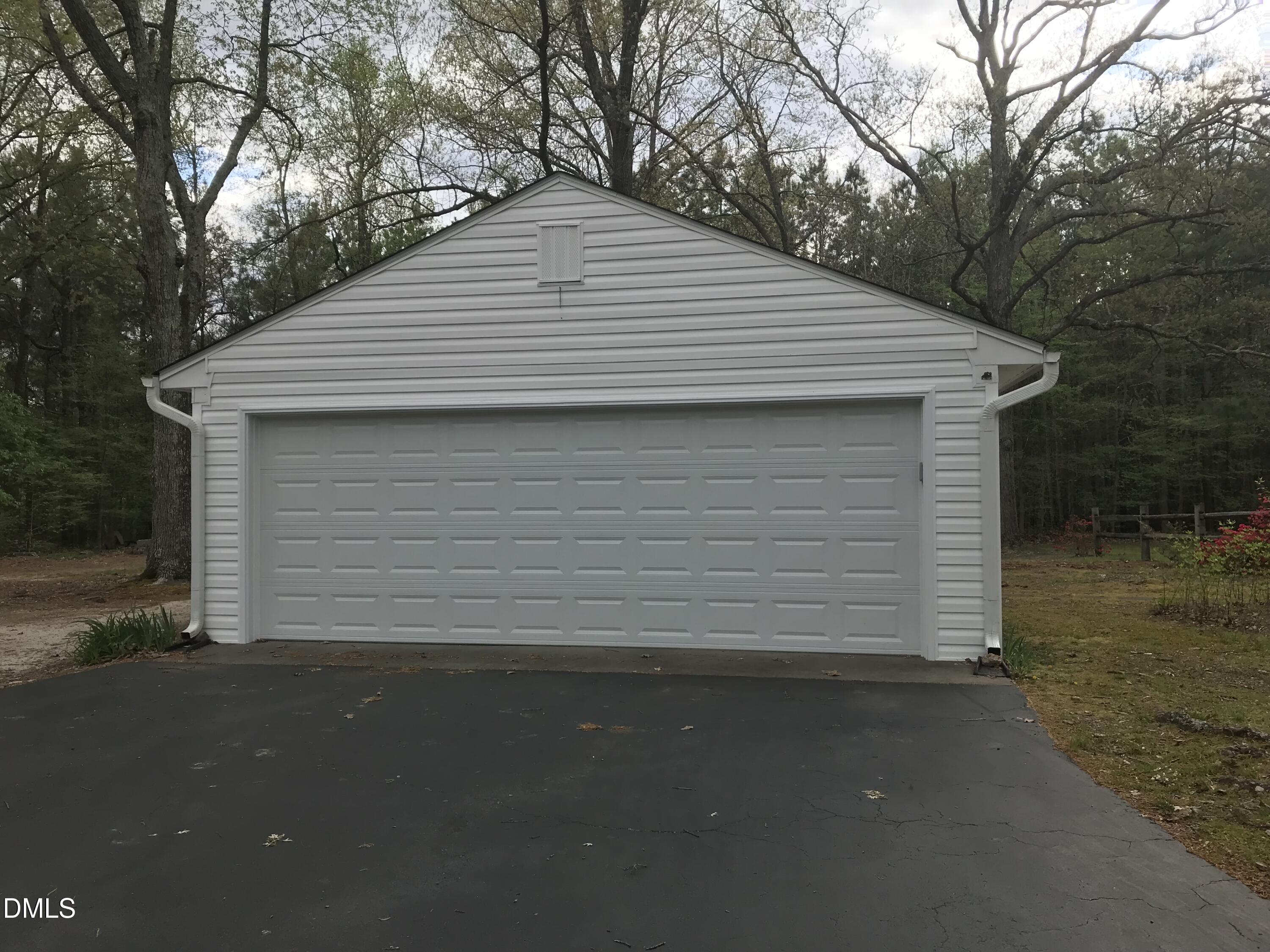 133 Sam Horton Road Louisburg, NC 27549 - Photo 4 of 15 a front view of a house with a garage