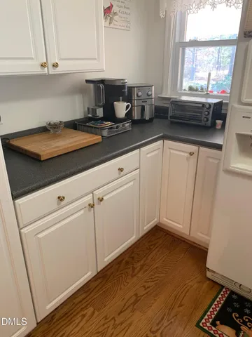 a kitchen with cabinets and appliances