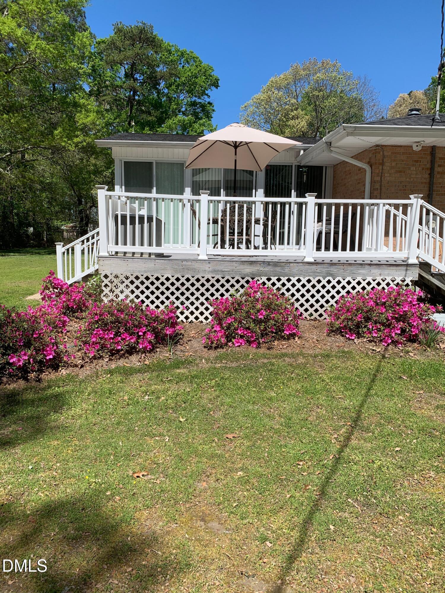 133 Sam Horton Road Louisburg, NC 27549 - Photo 7 of 15 a front view of a house with garden