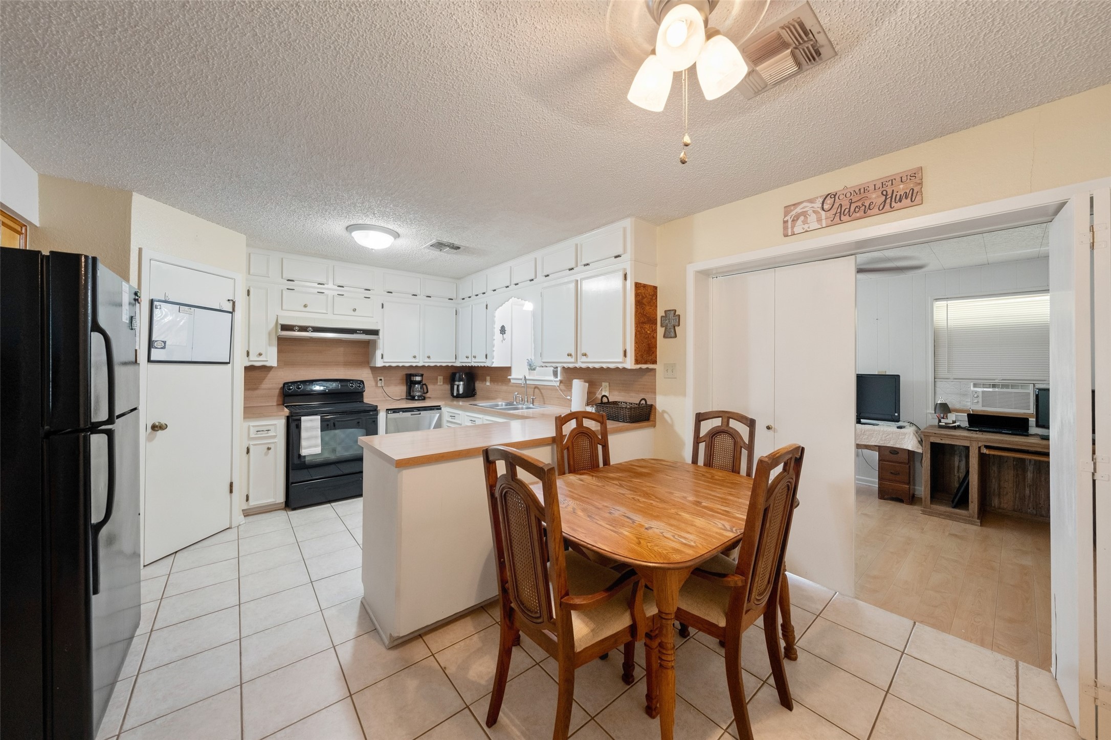 25739 Old Howth Road Hempstead, TX 77445 - Photo 11 of 36 Extensive upper and lower cabinetry, a large pantry and ample counter space provide plenty of room for meal prep, storage and serving, while the open connection to the adjoining spaces makes it easy to stay connected to all the action.