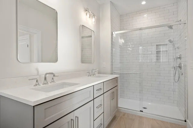 a view of a room with wooden floor and bathroom
