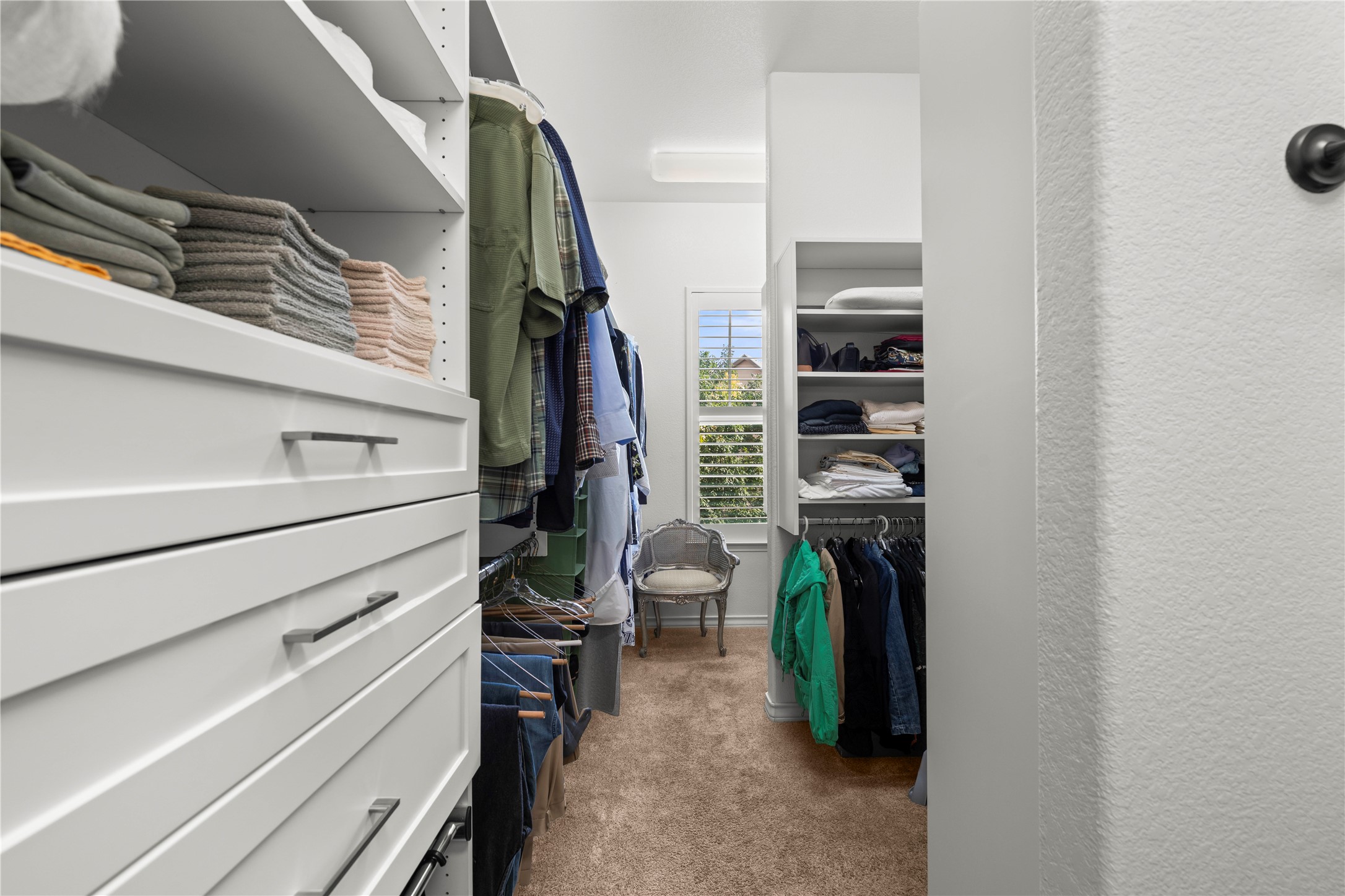 204 Adams Street Georgetown, TX 78628 - Photo 20 of 33 Ample built-in storage solutions create an organized and functional walk-in closet.