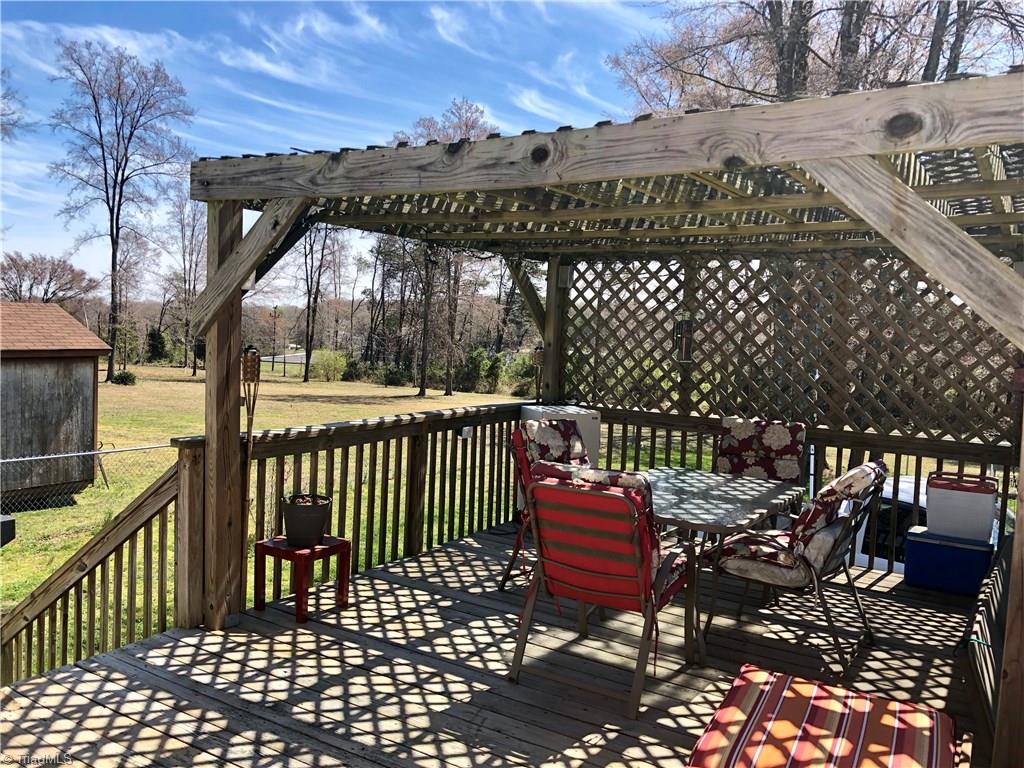 920 East Meadow Road Eden, NC 27288 - Photo 16 of 18 12 x 24 deck with pergola, roll up screen and surround sound