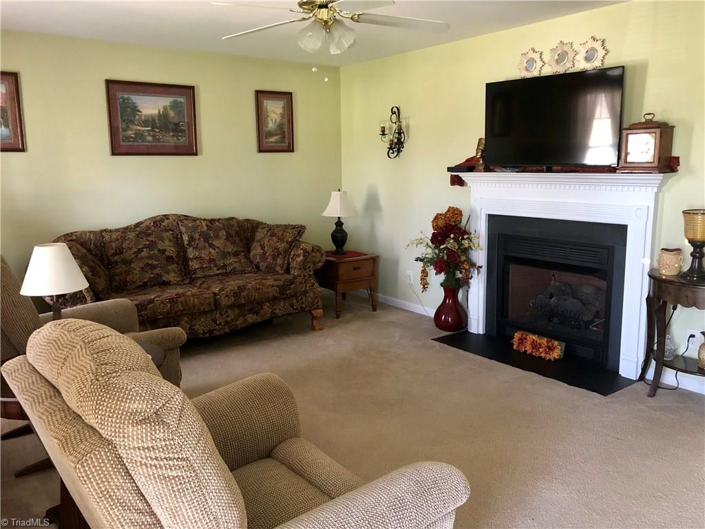 920 East Meadow Road Eden, NC 27288 - Photo 3 of 18 living room with gas log fireplace