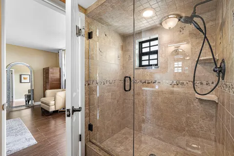 a bathroom with a double vanity sink mirror and toilet