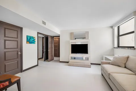 a view of walk in closet with clothes