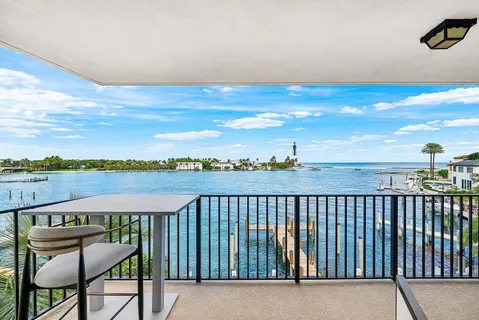 a balcony with a lake view