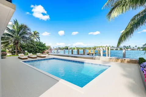 a view of a swimming pool with a terrace