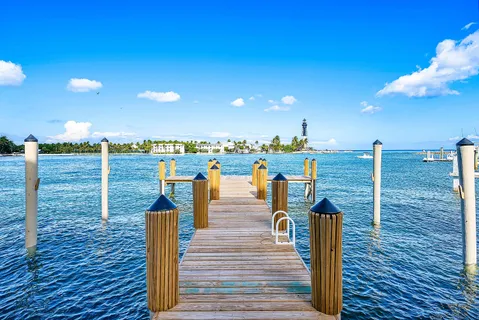 a view of a swimming pool with a table and chairs