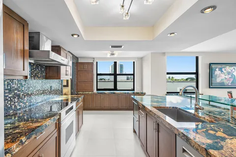 a stove top oven sitting inside of a kitchen